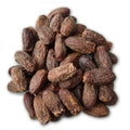 Pile of dark brown wrinkled dried dates, loose fruit