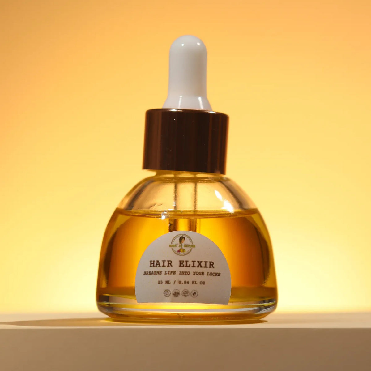 Hair elixir bottle, amber glass with white pump, 30 ml.
