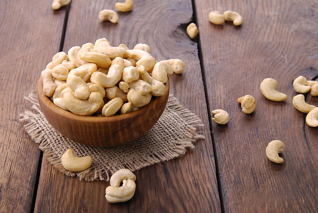 Cashews in a wooden bowl, whole raw cashew nuts