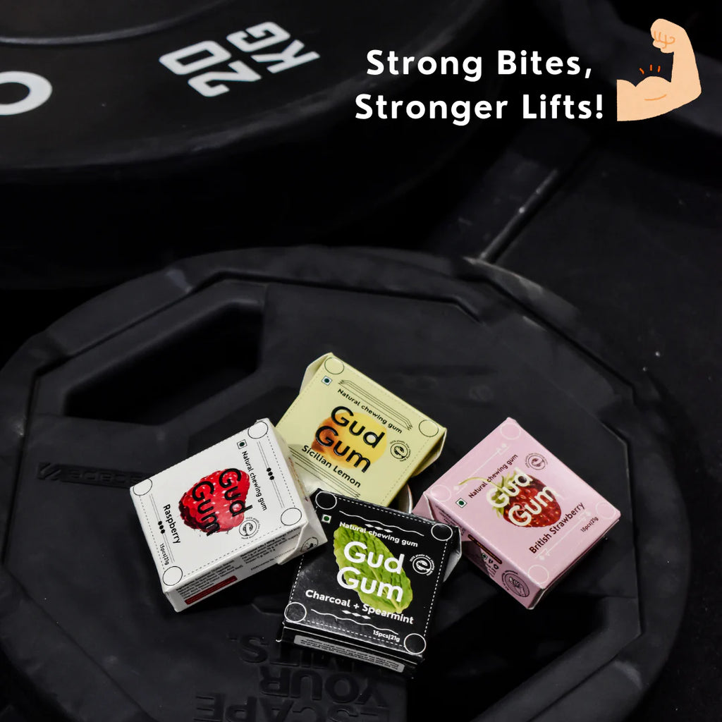 Gud Gum mini packs on tray: charcoal mint, lemon, strawberry, raspberry