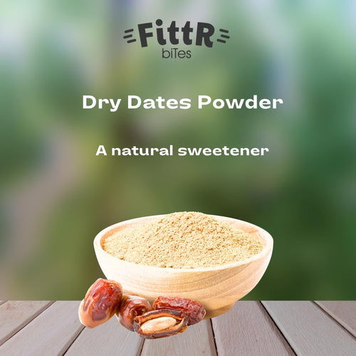 Dry dates powder heap in a wooden spoon