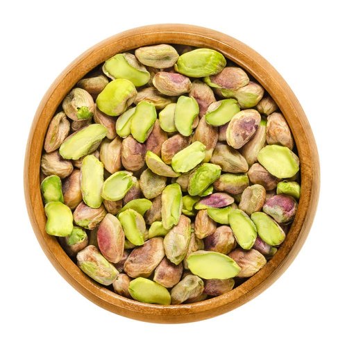 Bowl of green and purple pistachio kernels (Iran pista)