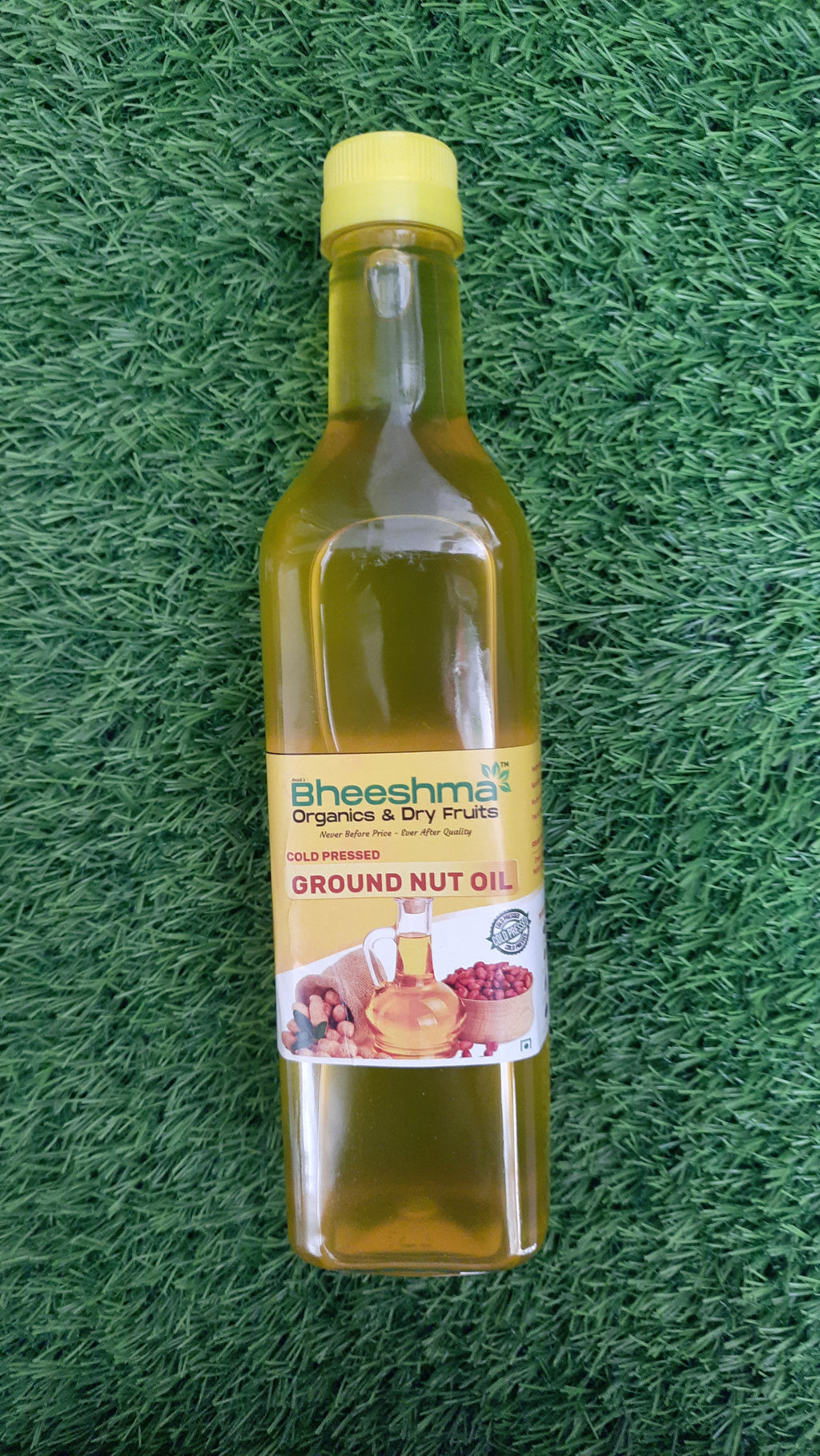 Groundnut oil bottle with Bheeshma Naturals label, yellow liquid inside
