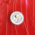 Hibiscus lip balm tin, round metal lid with Hibiscus variant label