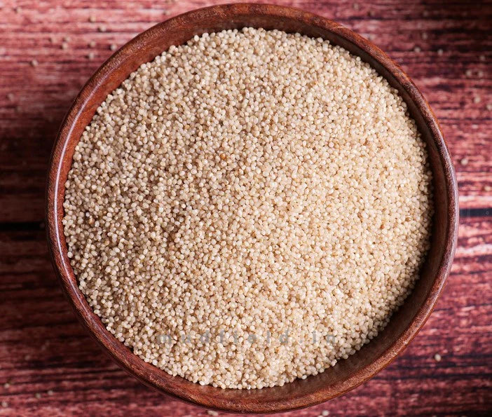 Bowl of little millet (samalu) grains, pale beige, filled and levelled