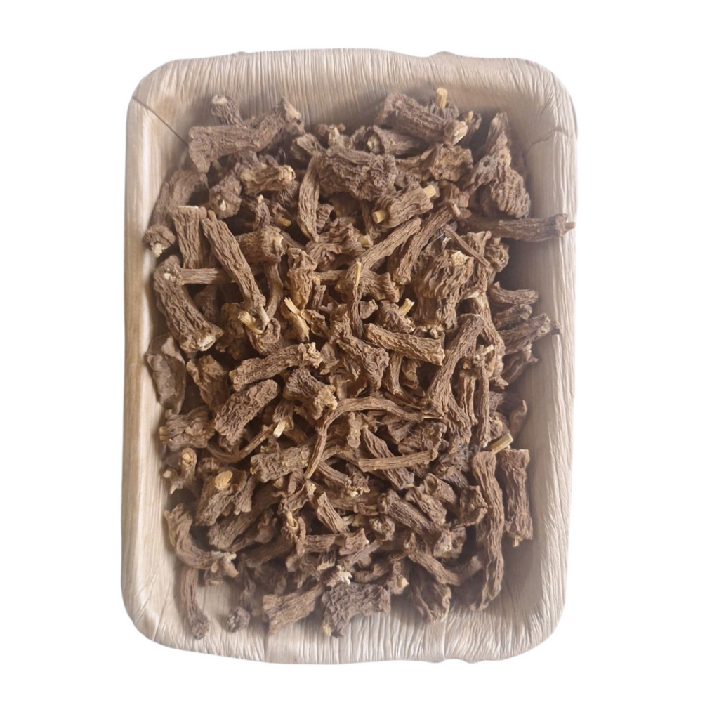 Chopped dried Nannari root pieces in square pouch, light brown