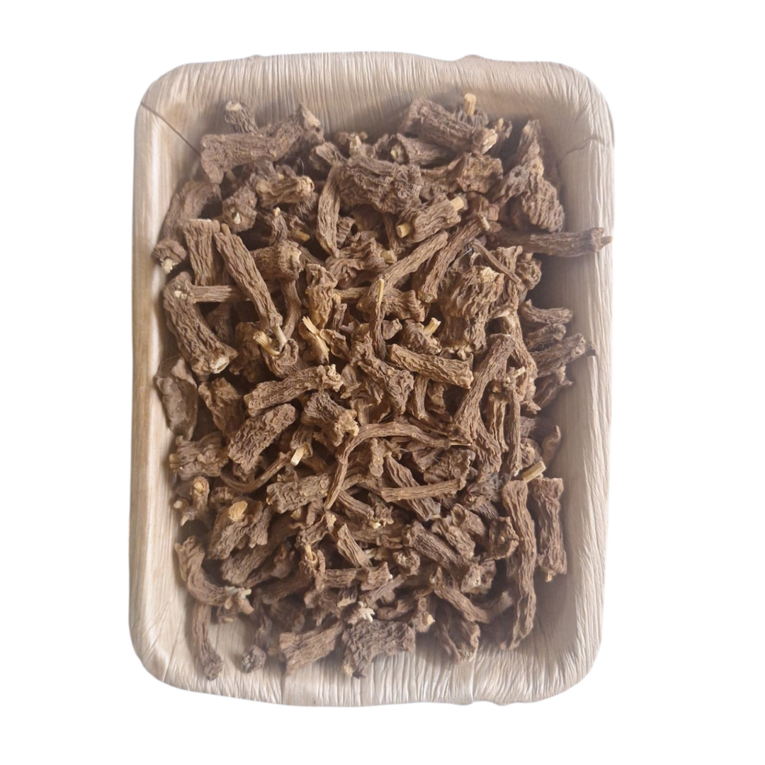 Chopped dried Nannari root pieces in square pouch, light brown