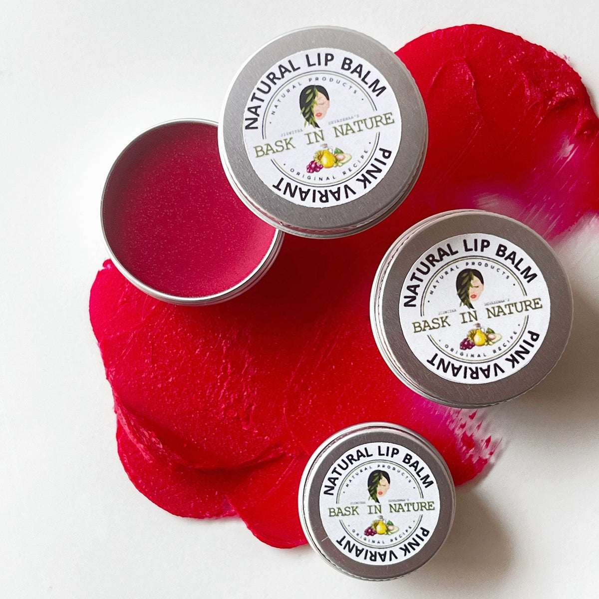 Pink lip balm tins with red balm, round silver lids