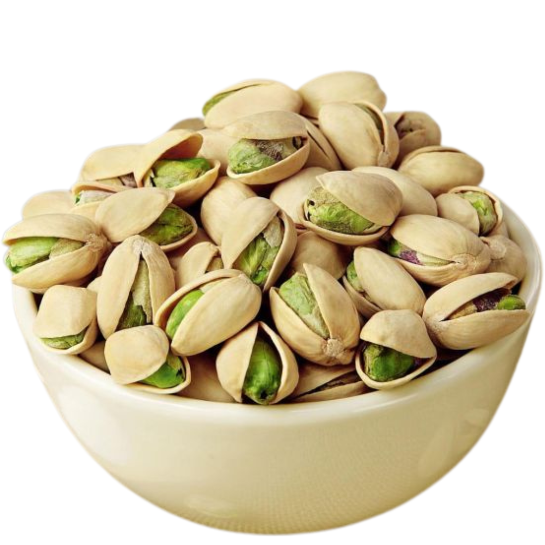 Roasted salted pistachios in shell, open green kernels in a shallow bowl.