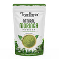True Herbs Natural Moringa pouch, green powder shown in circular window