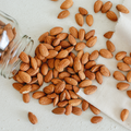 Whole California bold almonds, scattered kernels
