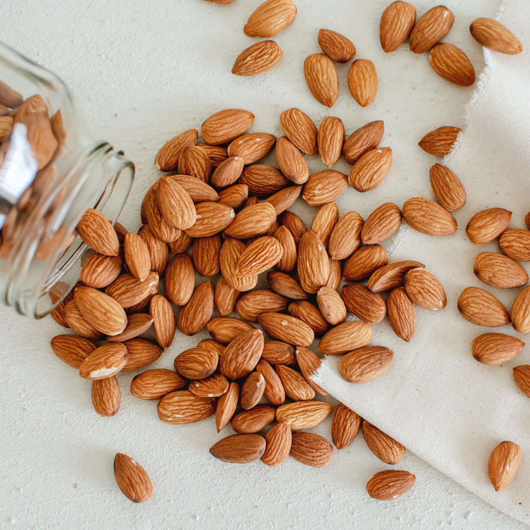 Whole California bold almonds, scattered kernels