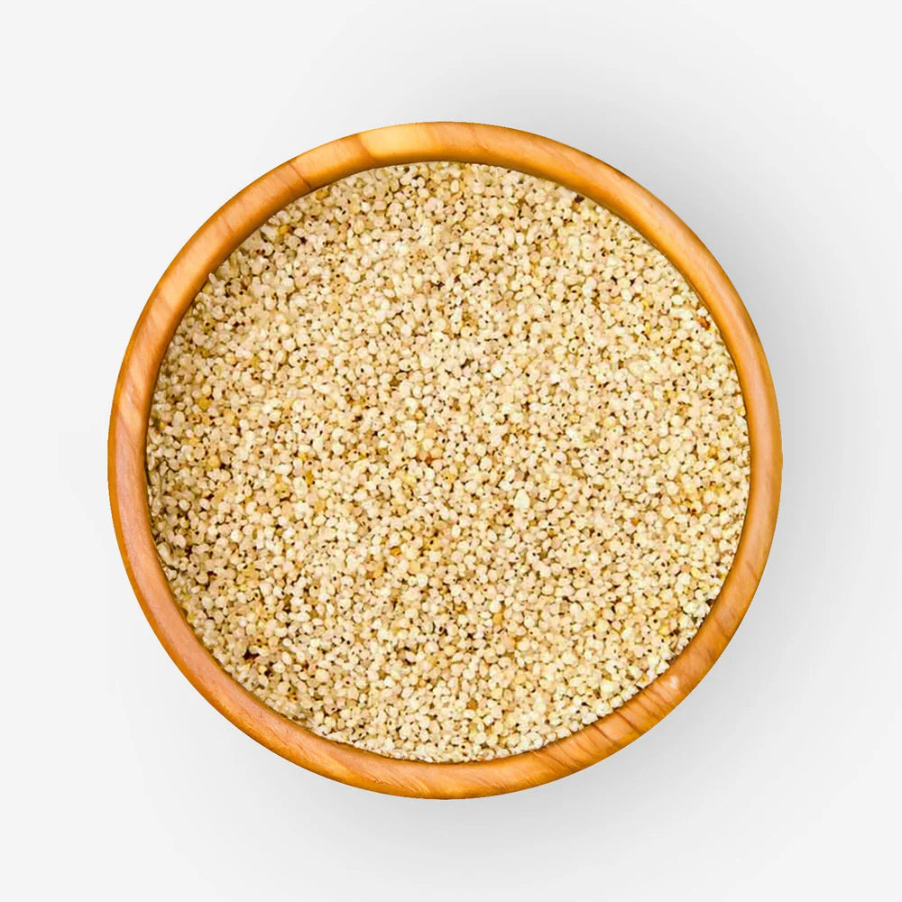 Bowl of barnyard millet Oodhalu with pale beige dry grains