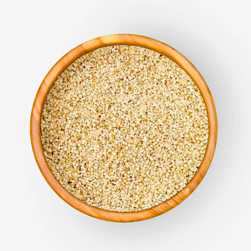 Bowl of barnyard millet Oodhalu with pale beige dry grains