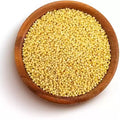 Foxtail millet grains in a wooden bowl