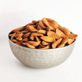 Iran Mamra almond kernels in metal bowl