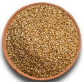 Round bowl of kodo millet grains, mixed tan and dark seeds