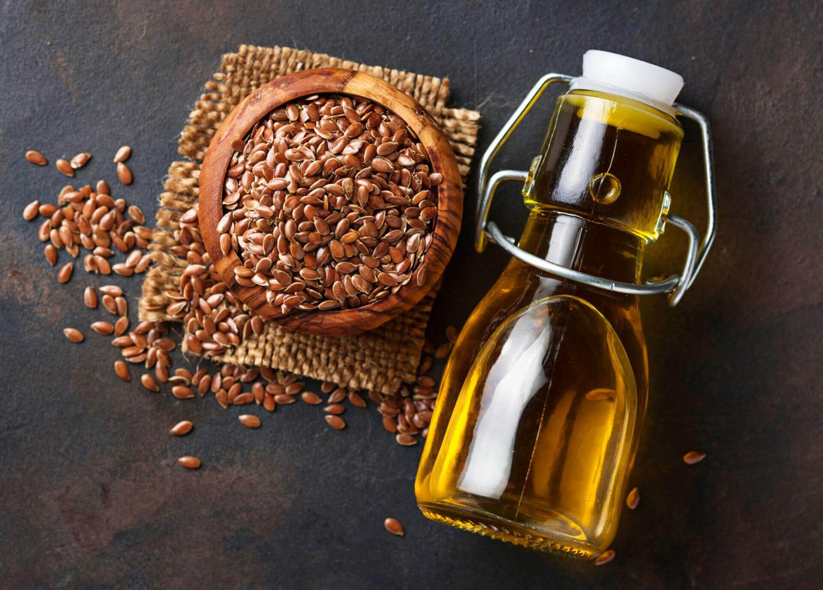 250ML flax seed oil bottle with amber oil and flax seeds in a bowl