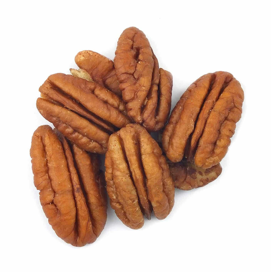 Shelled pecan halves, ridged brown kernels piled together