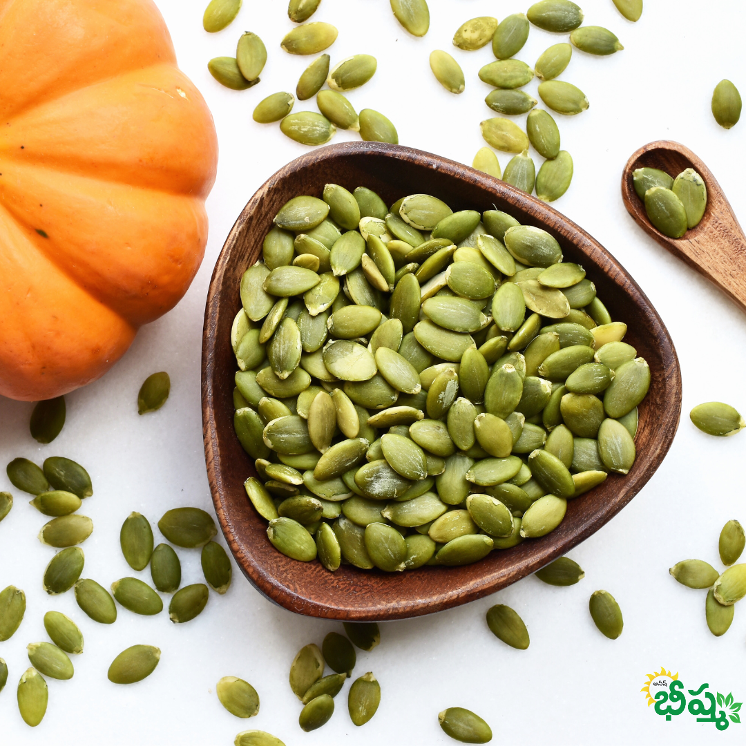 Green pumpkin seeds in a wooden bowl with scattered seeds around