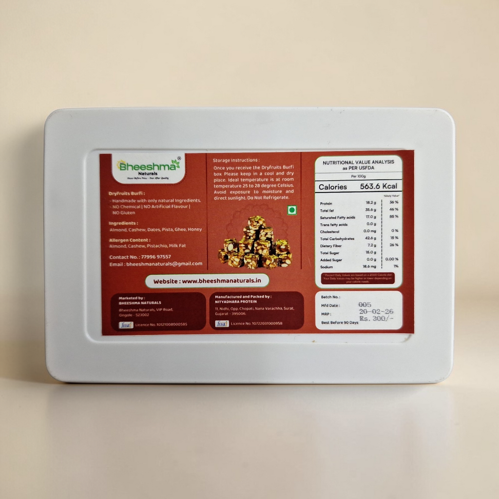 Dry fruits burfi back label in white tray, nutrition and ingredients panel visible.